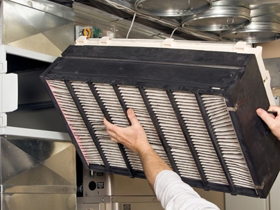 Tech checking out HVAC unit