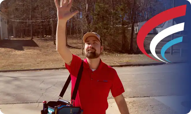 A man in a red shirt and cap stands outside, raising his hand. He carries a blue bag and is on a suburban street with trees in the background. A stylized logo appears on the right.